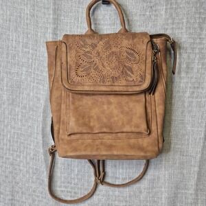 Backpack/ Carry All made from faux leather with a stamped/embossed‎ finish.
